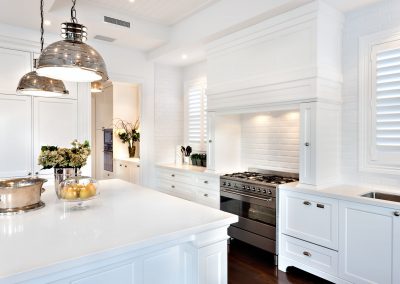 white kitchen with white marble Island countertop